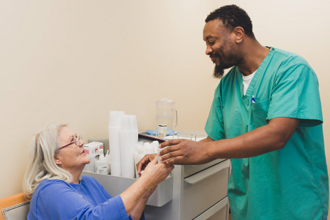 Caregiver interacting with a resident at Charlesgate Senior Living Center