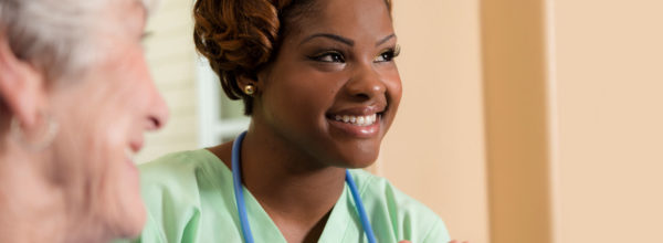 nurse smiling at someone off camera