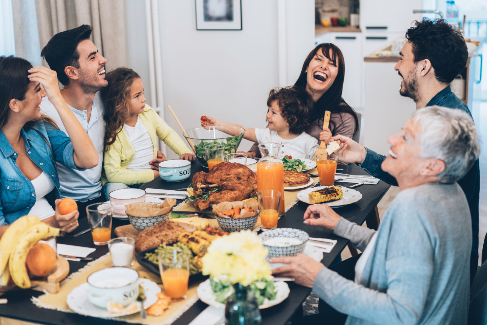 Beautiful big family enjoys Thanksgiving dinner together